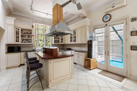 a kitchen with stainless steel appliances kitchen island granite countertop a sink and cabinets