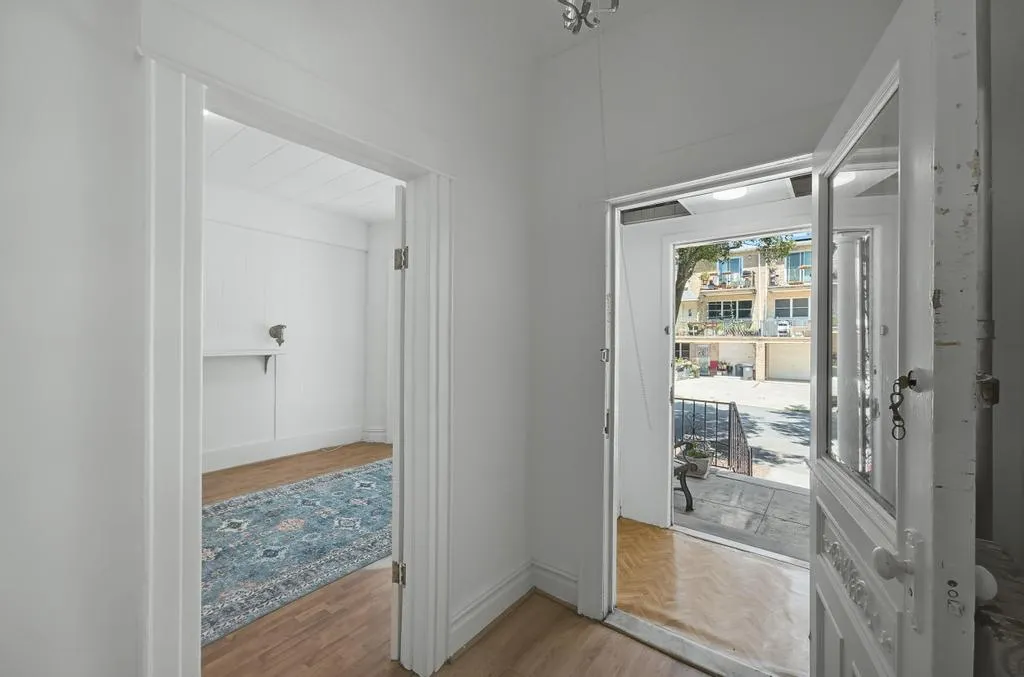 a bathroom with a glass shower door and a sink