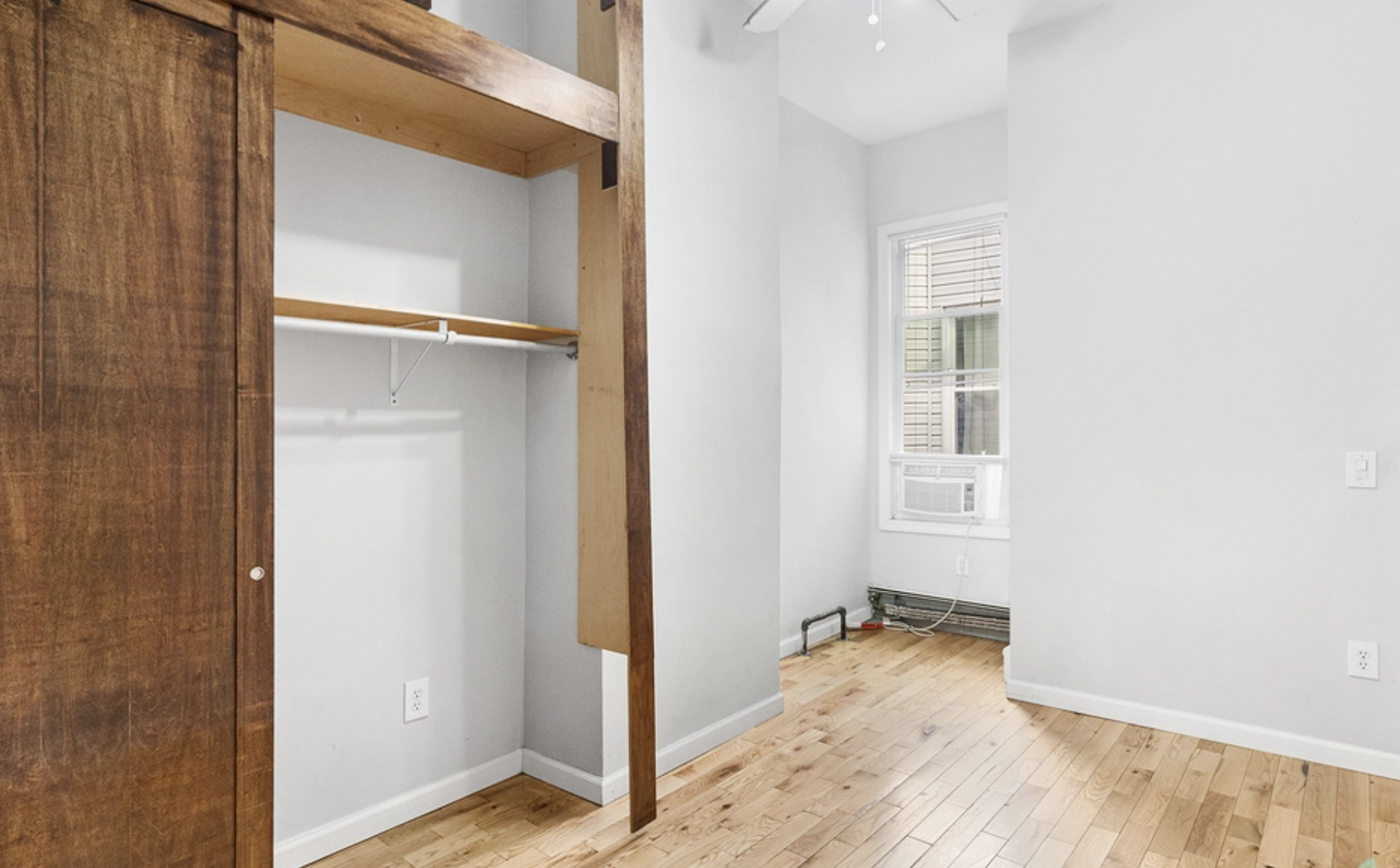 22-18 41st Street, Unit 2R Queens, NY 11105 - Photo 7 of 10 a view of empty room with wooden floor