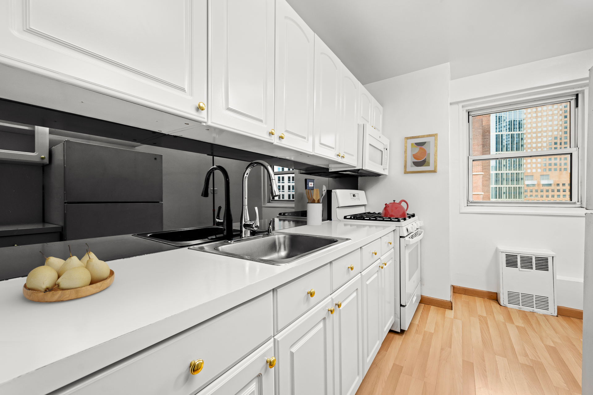 191 Willoughby Street, Unit 12N Brooklyn, NY 11201 - Photo 4 of 13 a kitchen with a sink and cabinets
