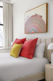 a bedroom with a bed and a couch