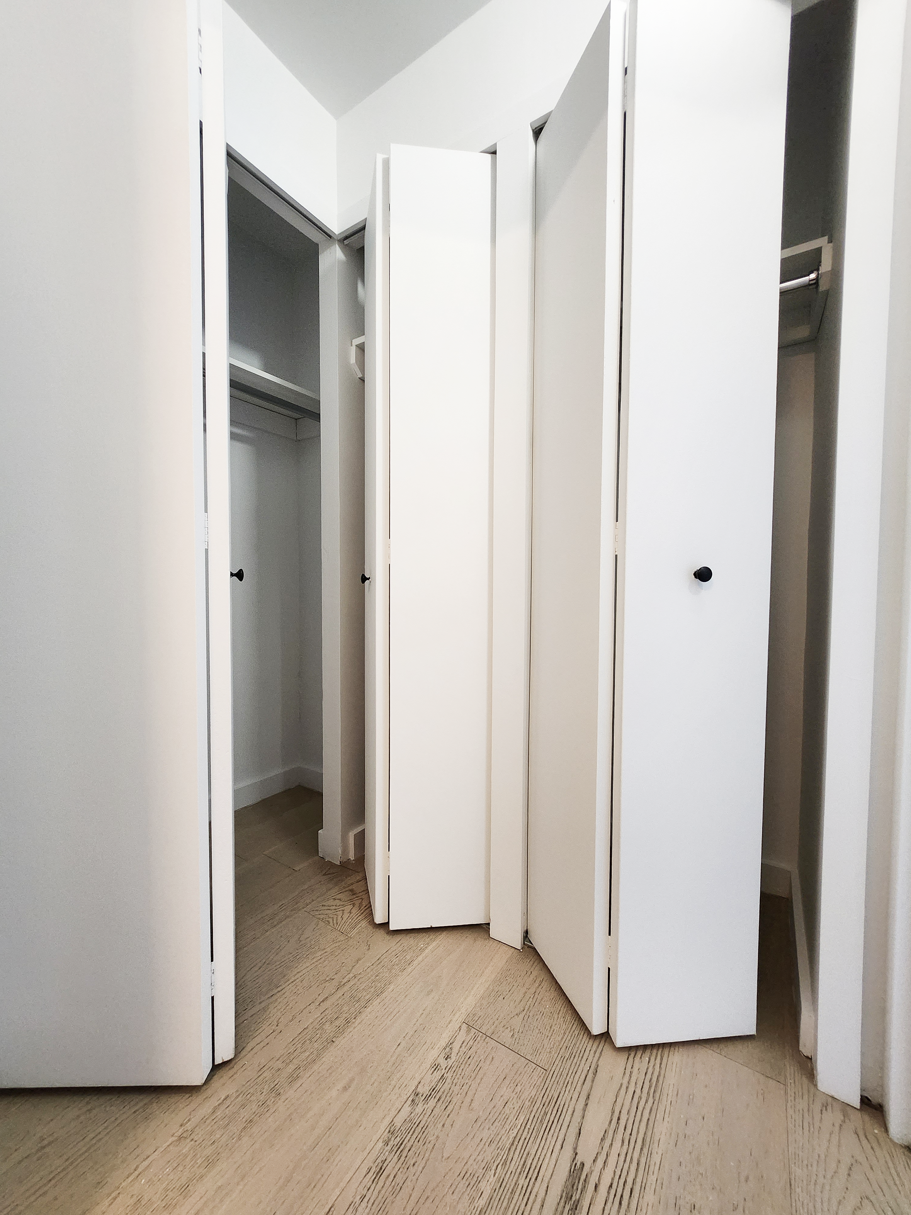 275 South Street, Unit 7PP Manhattan, NY 10002 - Photo 6 of 19 a view of an empty room with closet and a window
