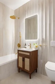 a bathroom with a sink a toilet and bathtub