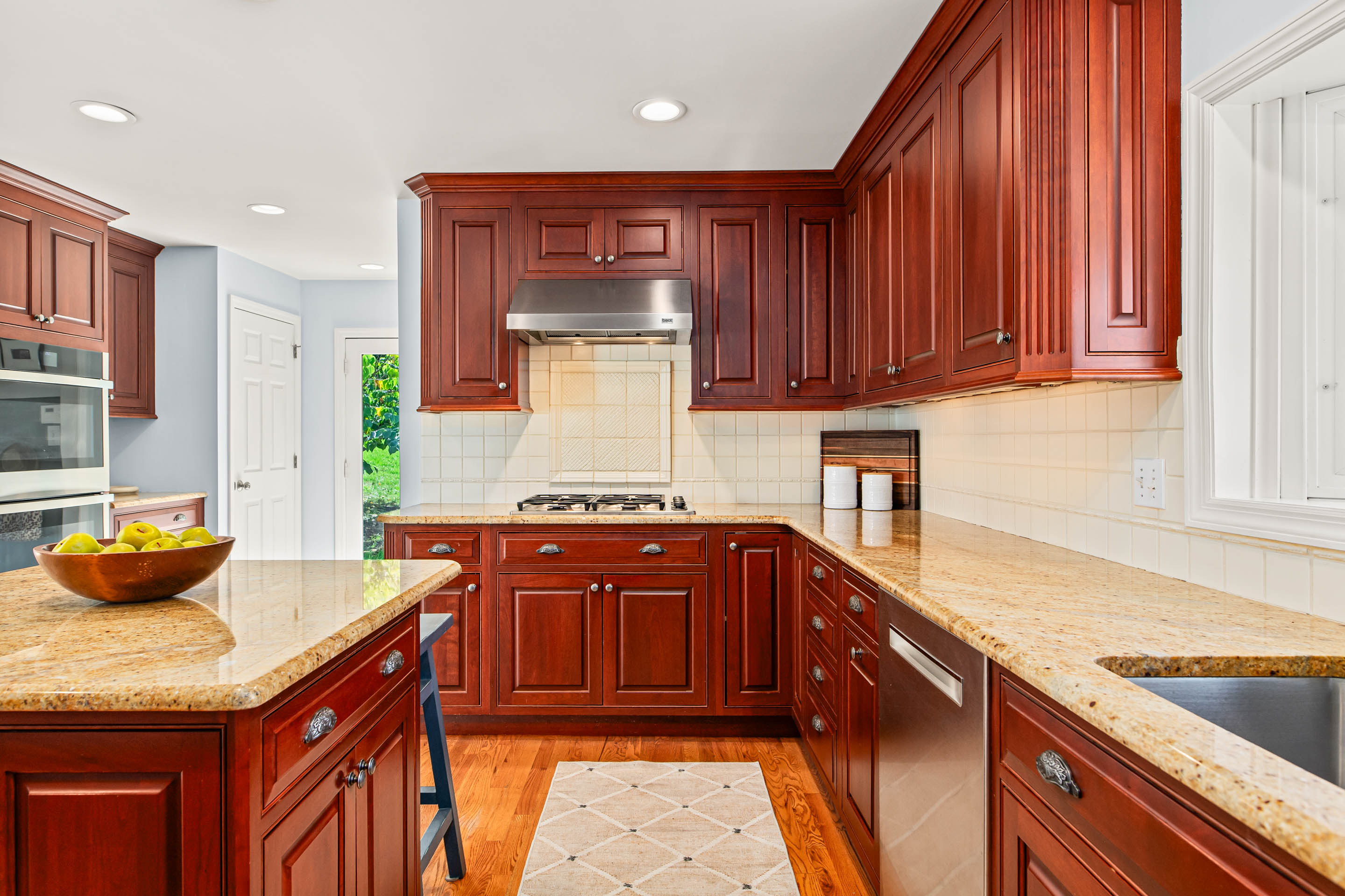 1136 Seaton Ross Road Wayne, PA 19087 - Photo 16 of 48 a kitchen with granite countertop cabinets and window