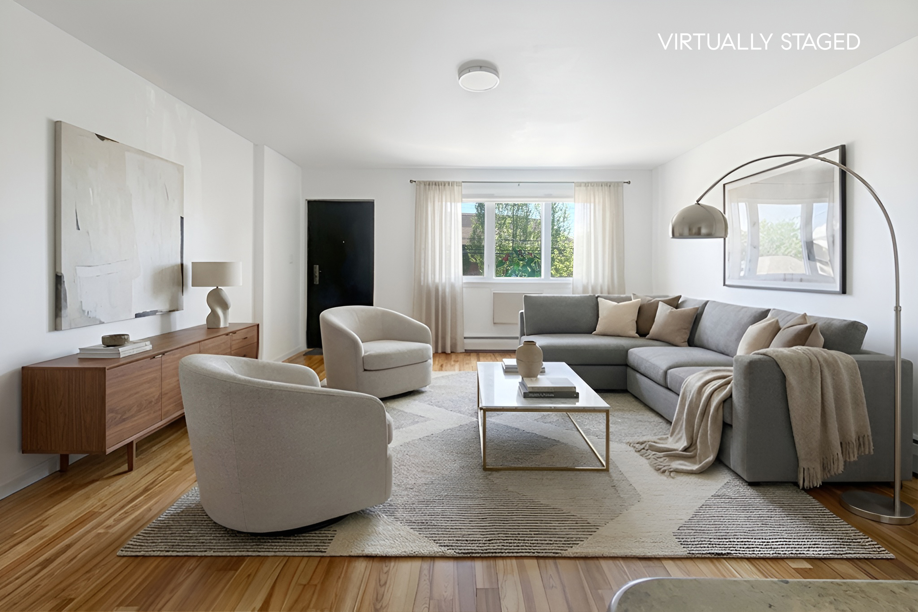 a living room with furniture and a large window