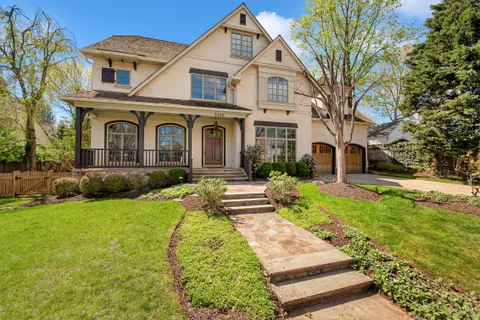 a front view of a house with a yard and porch
