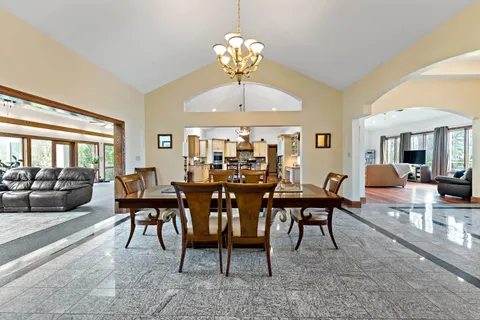 a kitchen with stainless steel appliances granite countertop a stove and cabinets