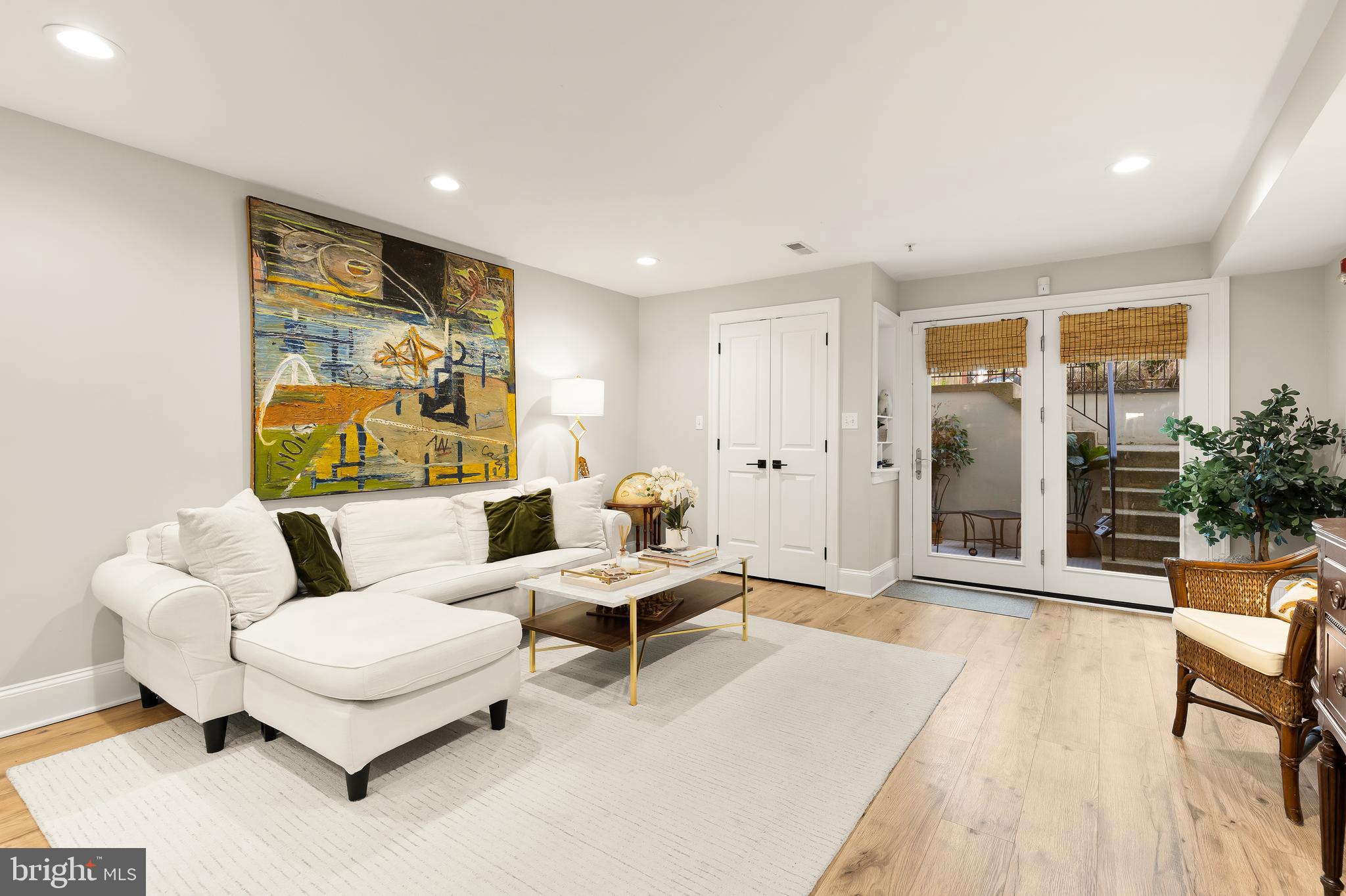 1354 Kenyon Street Northwest, Unit G Washington, DC 20010 - Photo 8 of 37 a living room with furniture and wooden floor