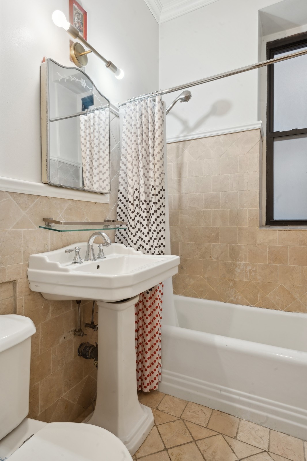 401 West End Avenue, Unit 1G Manhattan, NY 10024 - Photo 8 of 9 a bathroom with a sink and mirror with toilet