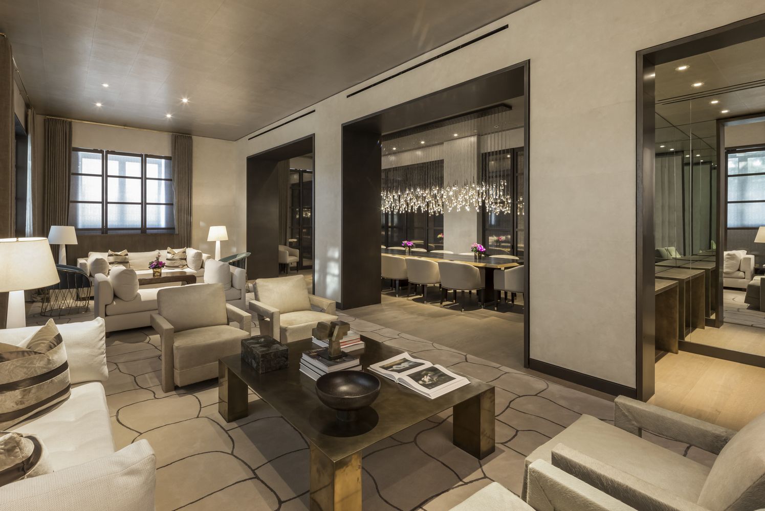 a living room with furniture and large windows