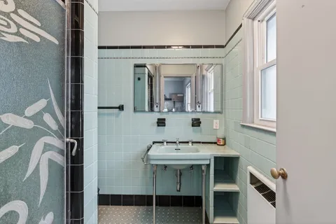 a bathroom with a sink and a mirror