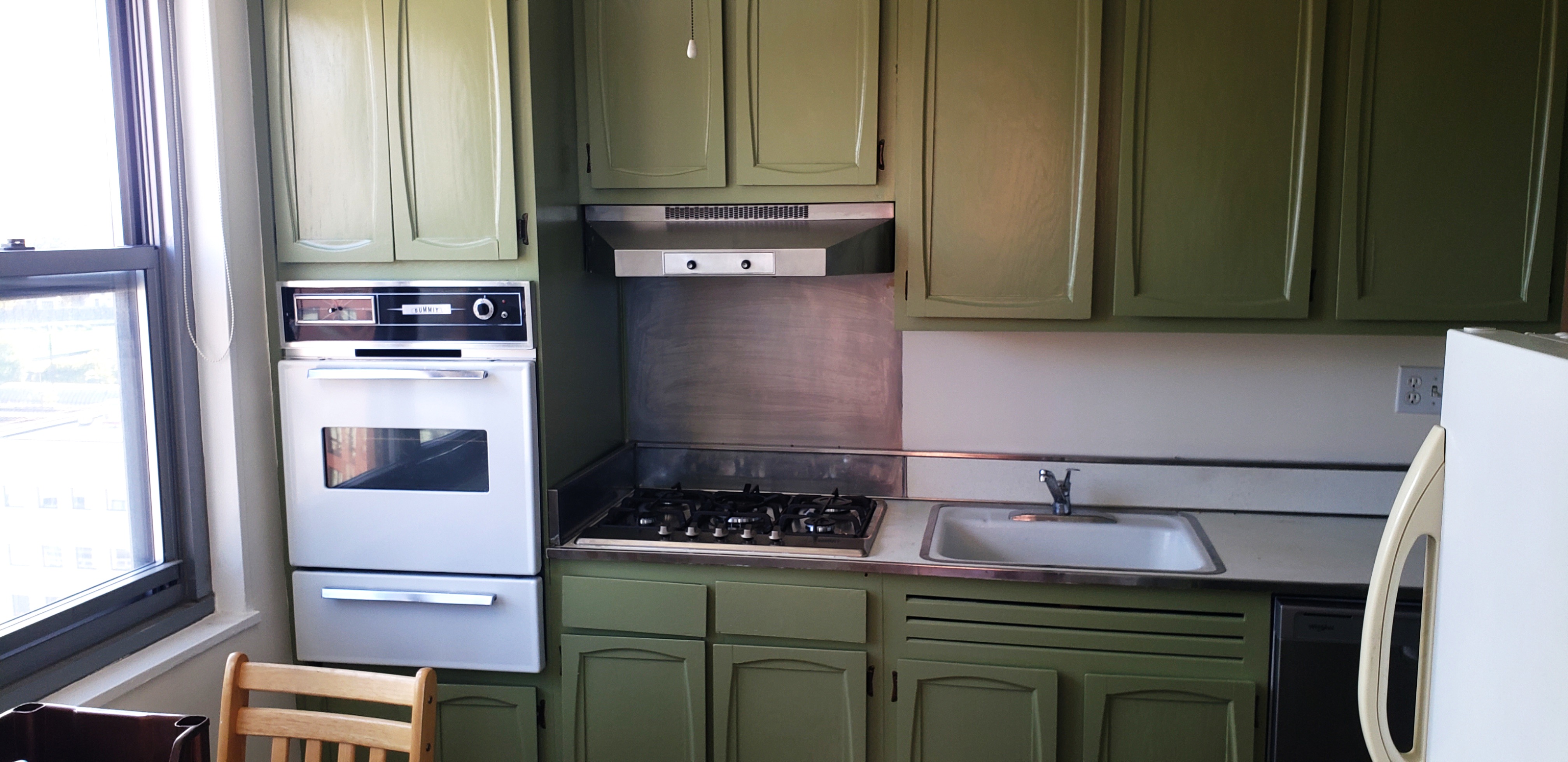 70-25 Yellowstone Boulevard, Unit 11D Queens, NY 11375 - Photo 4 of 25 a kitchen with a refrigerator and a stove top oven