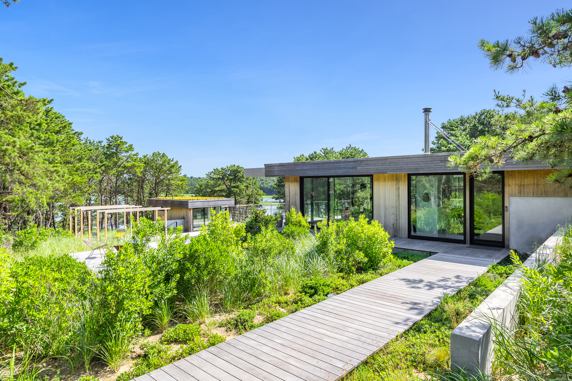 375 King Phillip Road Wellfleet, MA 02667 - Photo 19 of 27 a front view of a house with garden