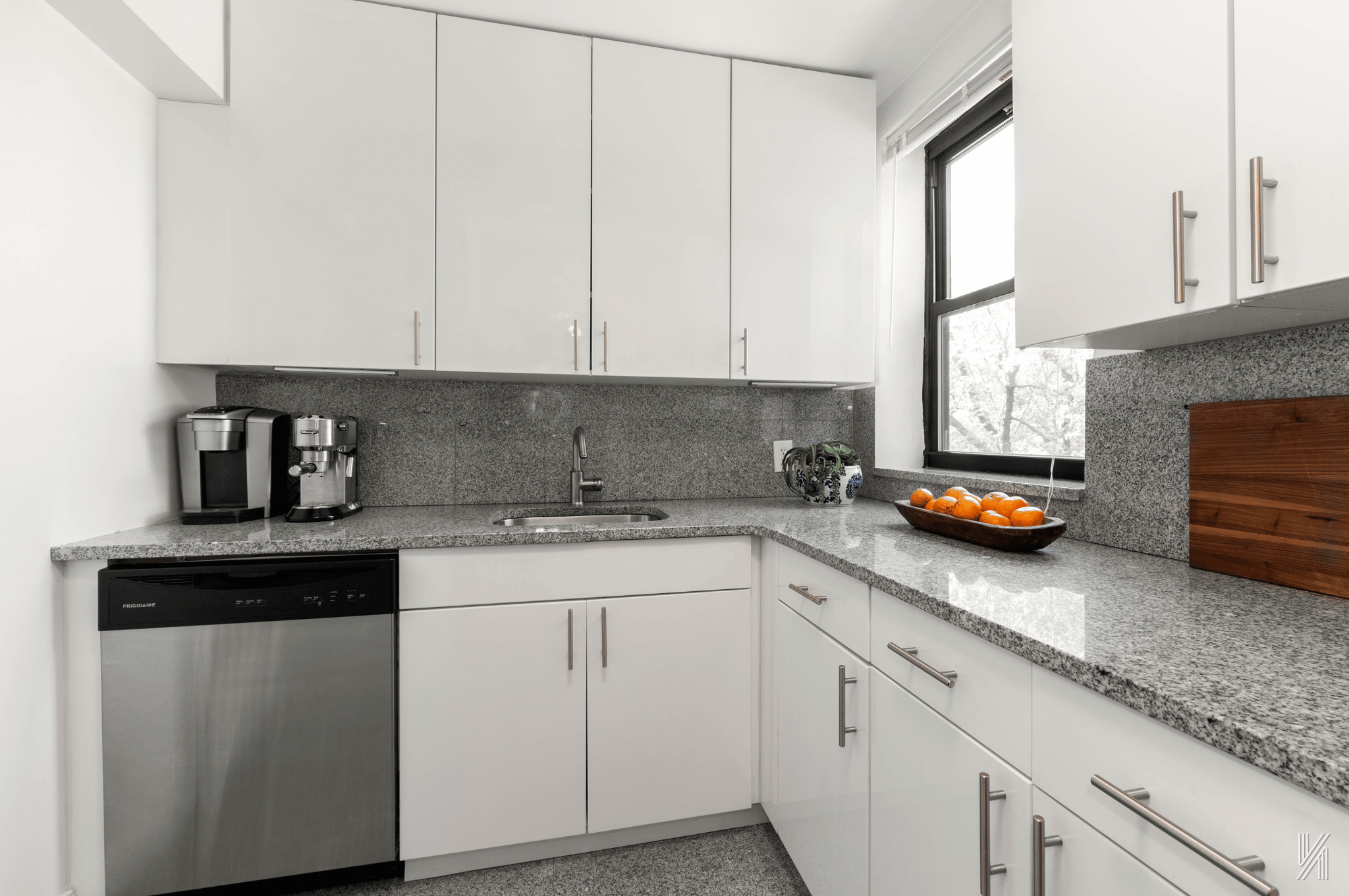 22-40 80th Street, Unit 3B Queens, NY 11370 - Photo 8 of 14 a kitchen with stainless steel appliances granite countertop a sink a stove and dishwasher with cabinets