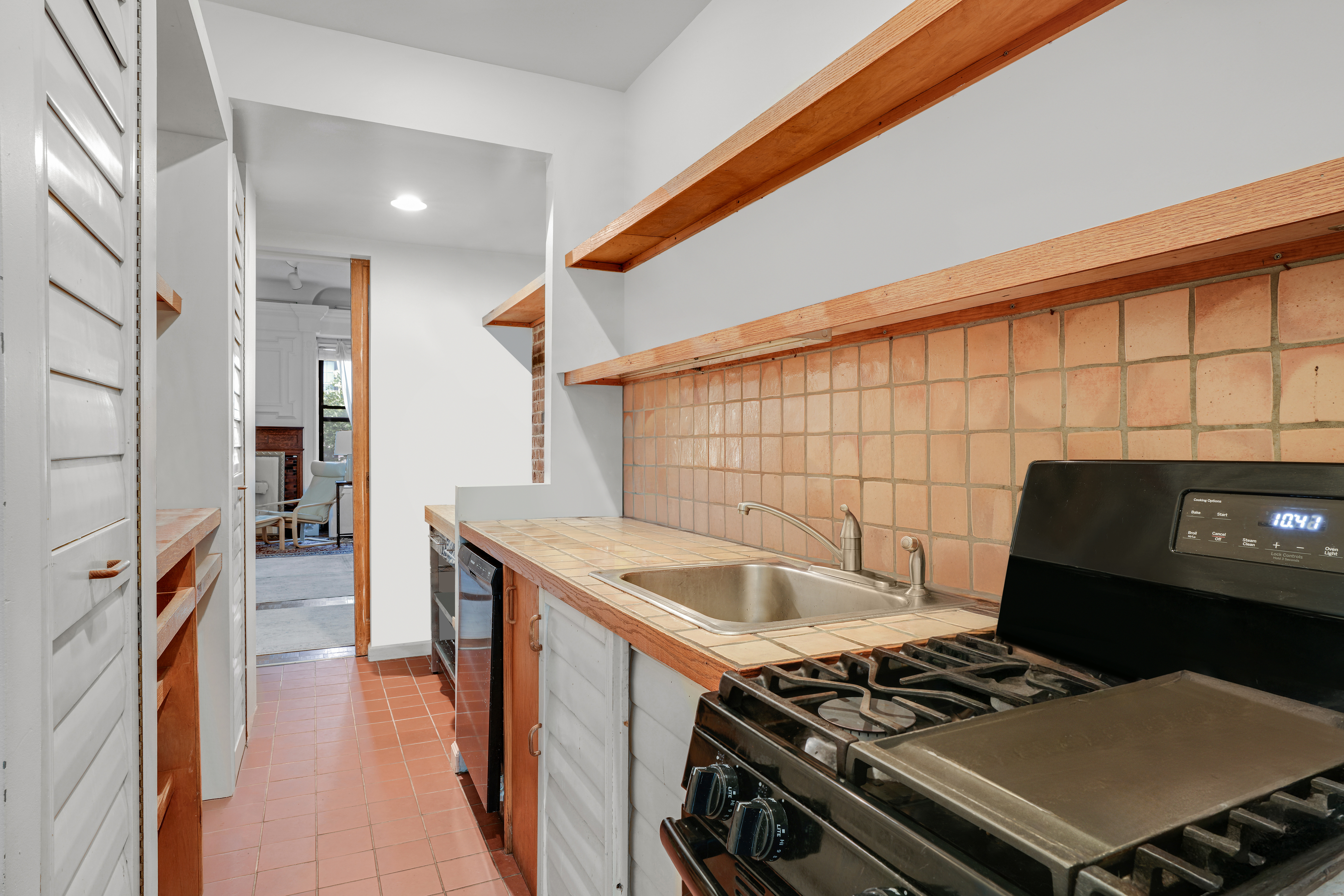 337 West 71st Street, Unit 3 Manhattan, NY 10023 - Photo 5 of 9 a kitchen with stainless steel appliances granite countertop a stove and a sink
