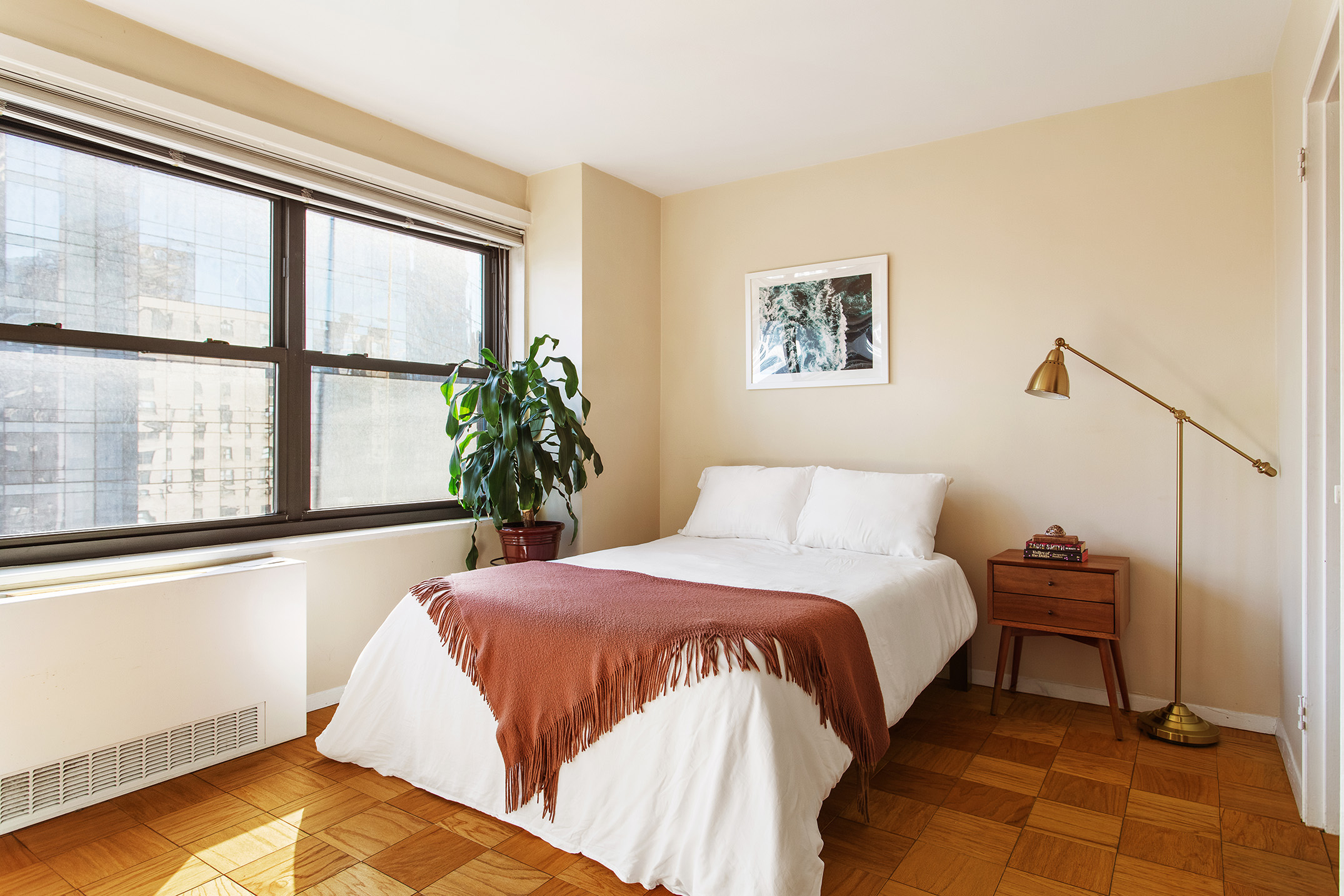 160 West End Avenue, Unit 23C Manhattan, NY 10023 - Photo 2 of 5 a bedroom with a bed and a window