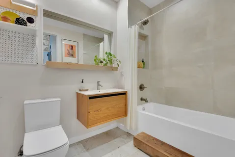 a utility room with sink dryer and washer
