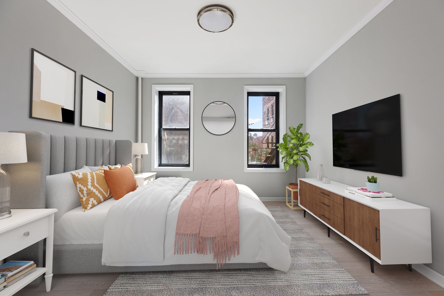 a bedroom with a bed and a flat screen tv