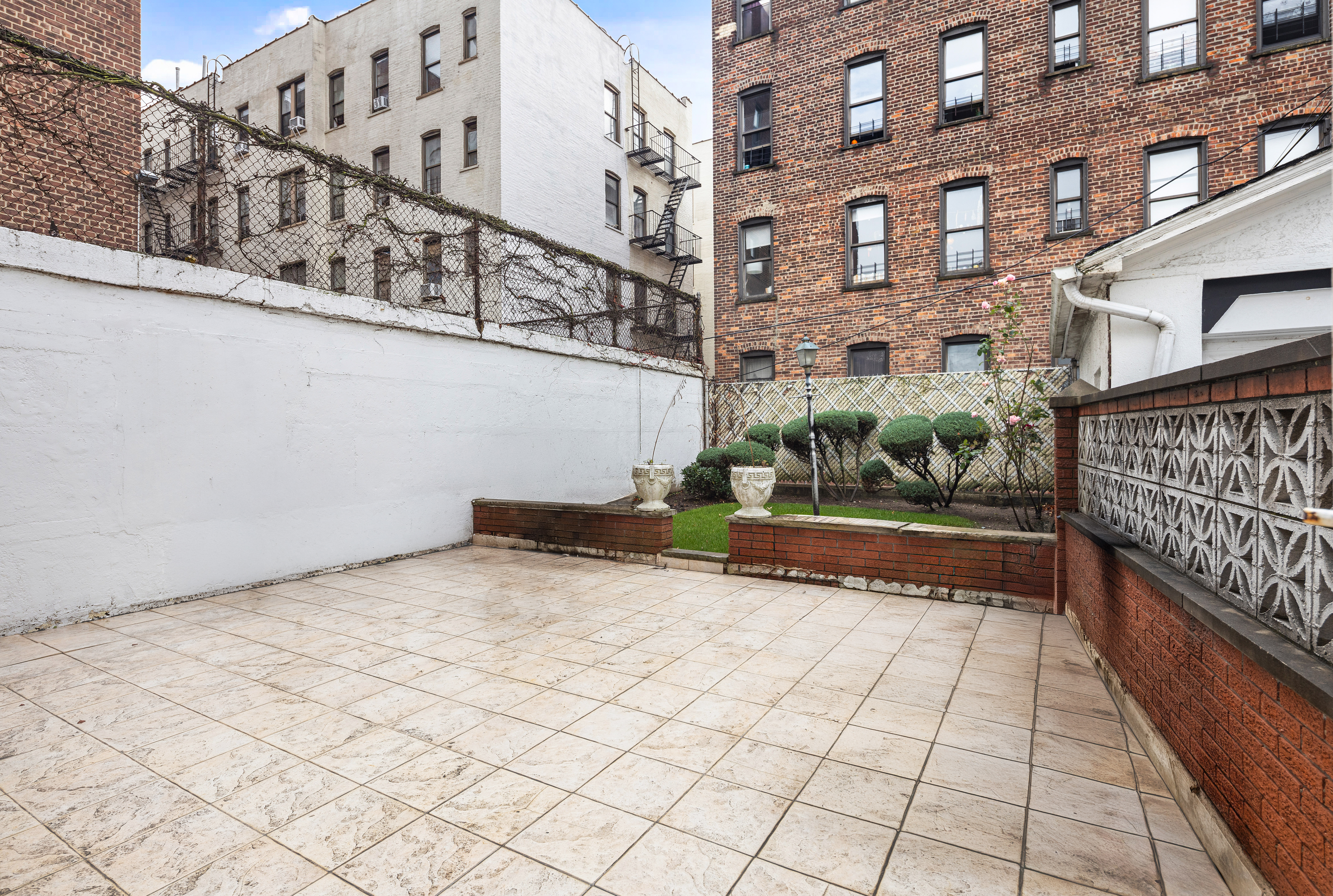 562 84th Street Brooklyn, NY 11209 - Photo 22 of 25 a view of a pathway along a building
