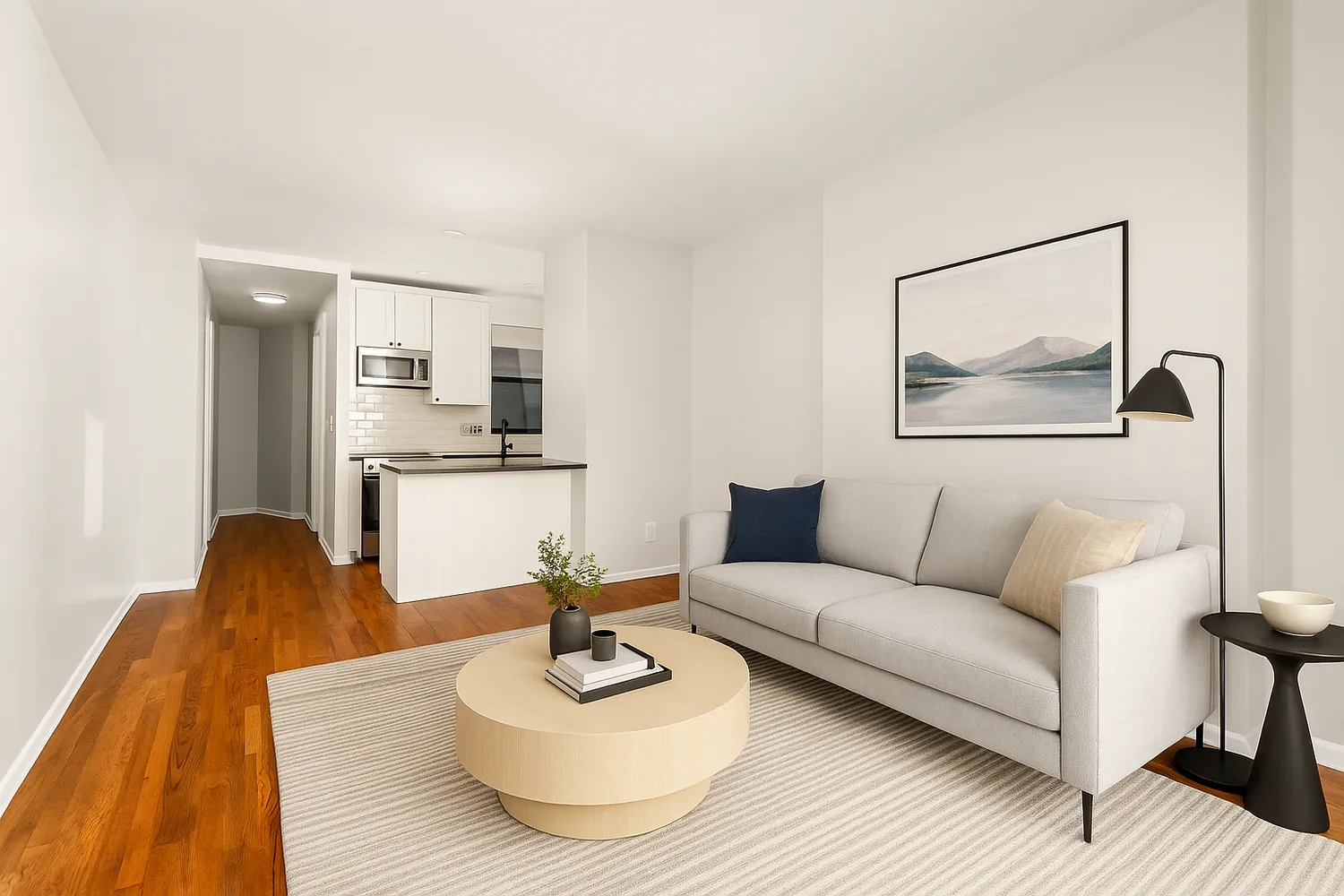 a living room with furniture and a wooden floor