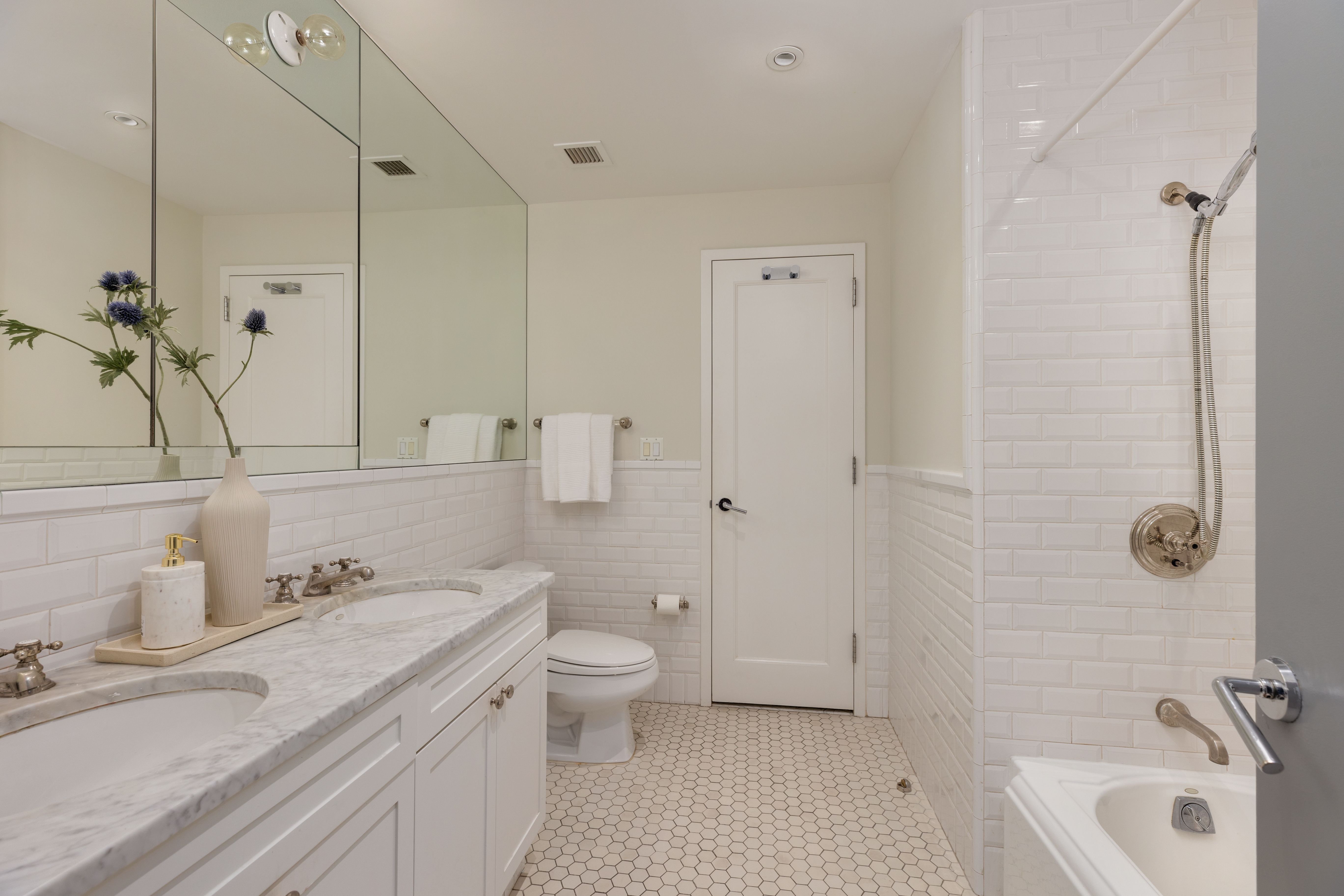 18 Leonard Street, Unit 2D Manhattan, NY 10013 - Photo 18 of 22 a bathroom with a granite countertop sink a toilet and shower