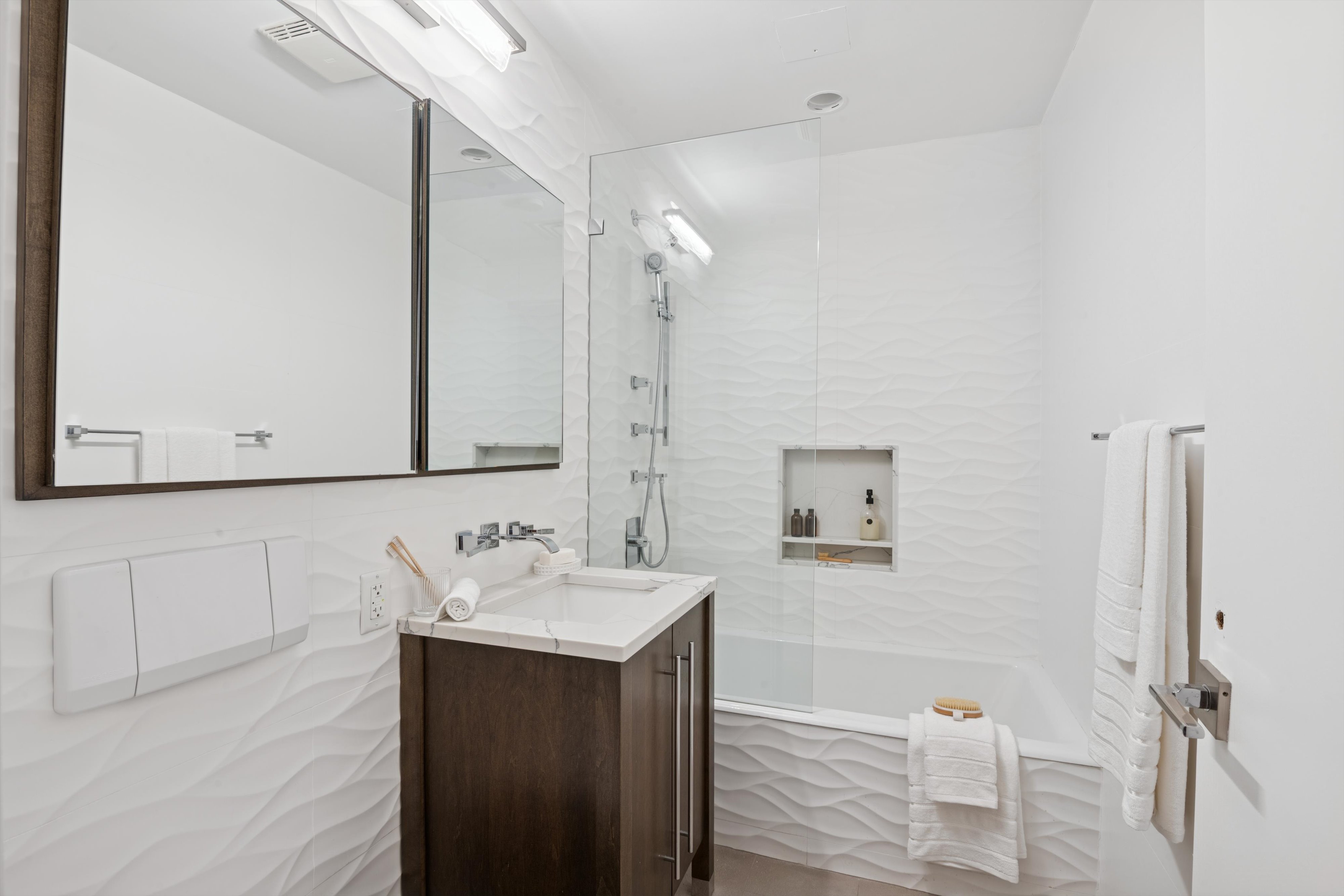 109 West 26th Street, Unit 9 Manhattan, NY 10001 - Photo 17 of 23 a bathroom with a sink and a mirror