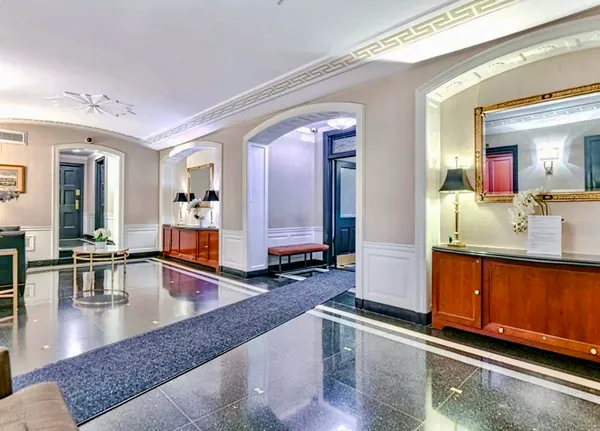 a large living room with granite countertop a couch