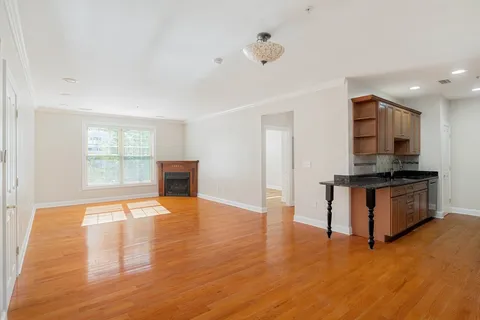 a view of kitchen with furniture and wooden floor