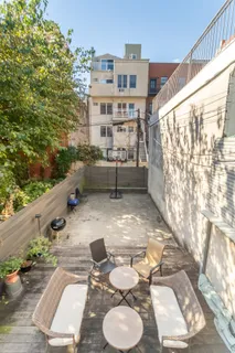 a backyard of a house with seating space