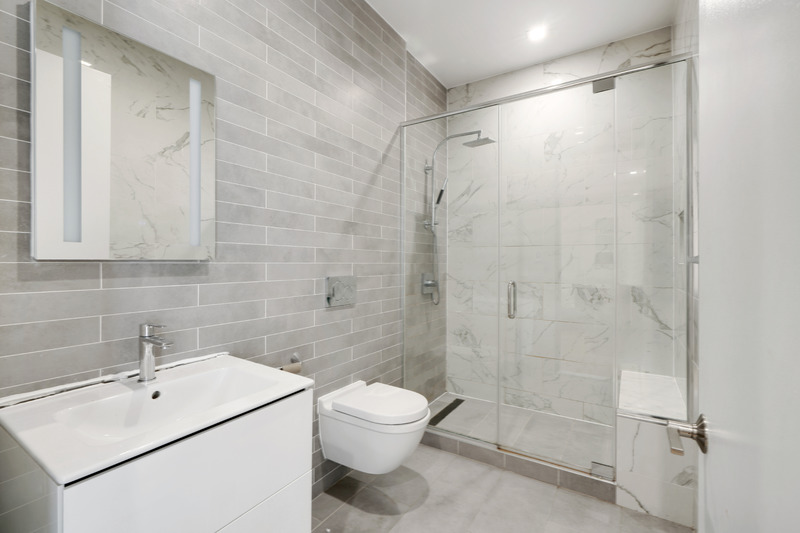 100 2nd Avenue, Unit 2 Manhattan, NY 10003 - Photo 9 of 10 a bathroom with a toilet sink and shower