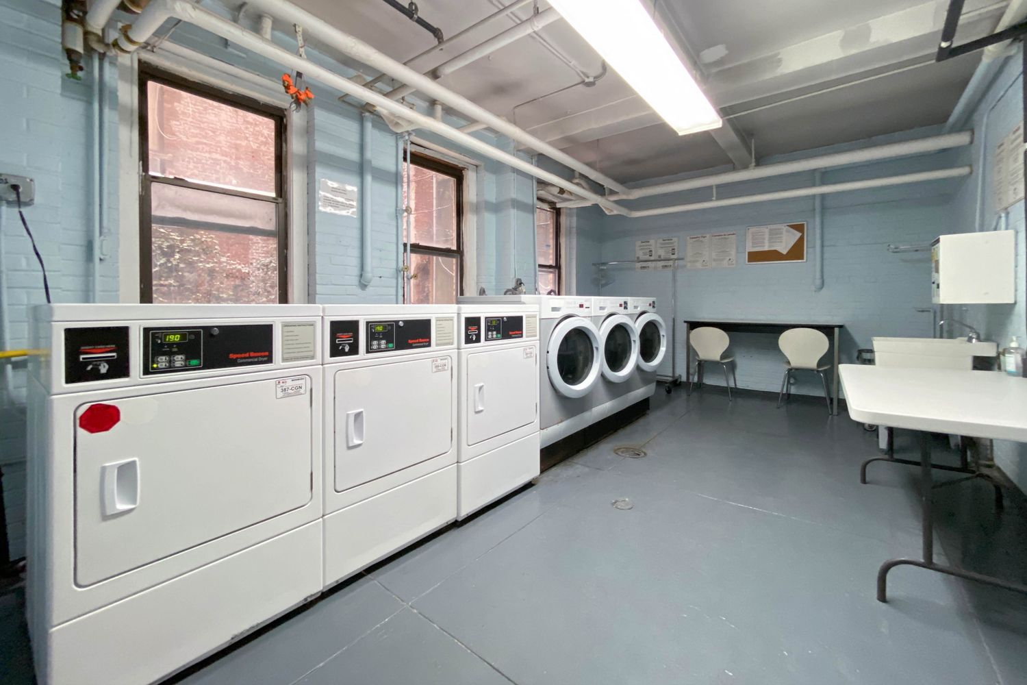 124 East 84th Street, Unit 1D Manhattan, NY 10028 - Photo 12 of 14 a utility room with dryer and washer