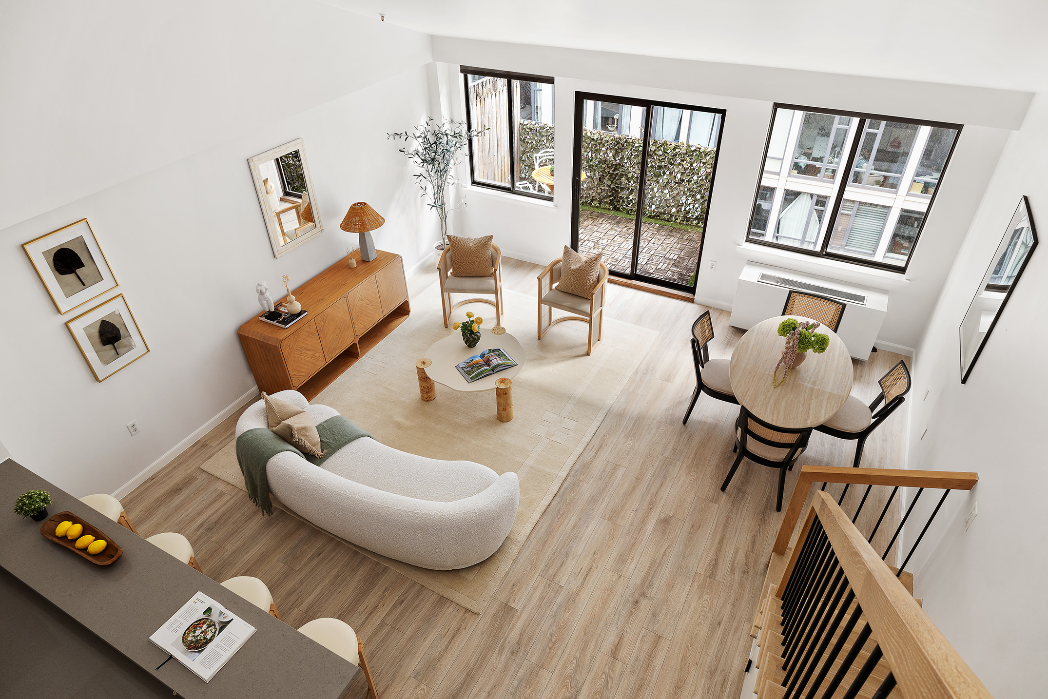 136-140 West 23rd Street, Unit PHD Manhattan, NY 10011 - Photo 5 of 15 a living room with furniture and floor to ceiling windows
