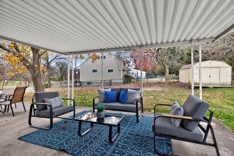 a outdoor living space with furniture and garden view