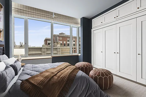 110 Livingston Street, Unit 17K Brooklyn, NY 11201 - Photo 4 of 11 a bedroom with a large bed and a large window