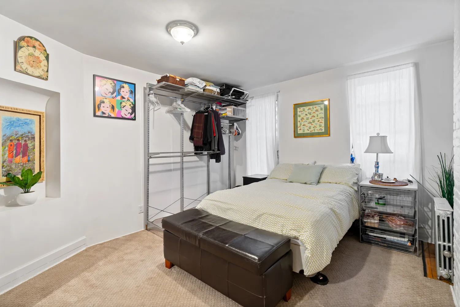 a spacious bedroom with a bed and a walk in closet