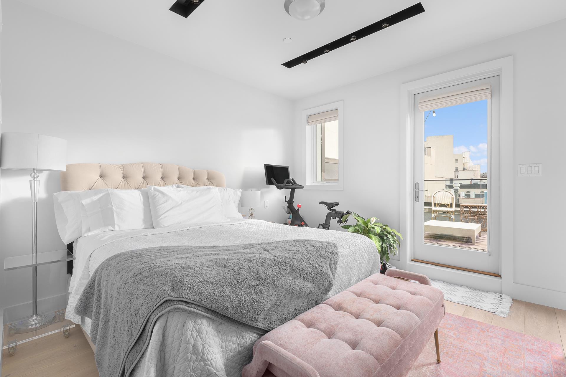 800 Dean Street, Unit PH Brooklyn, NY 11238 - Photo 4 of 11 a bedroom with two beds and painted walls