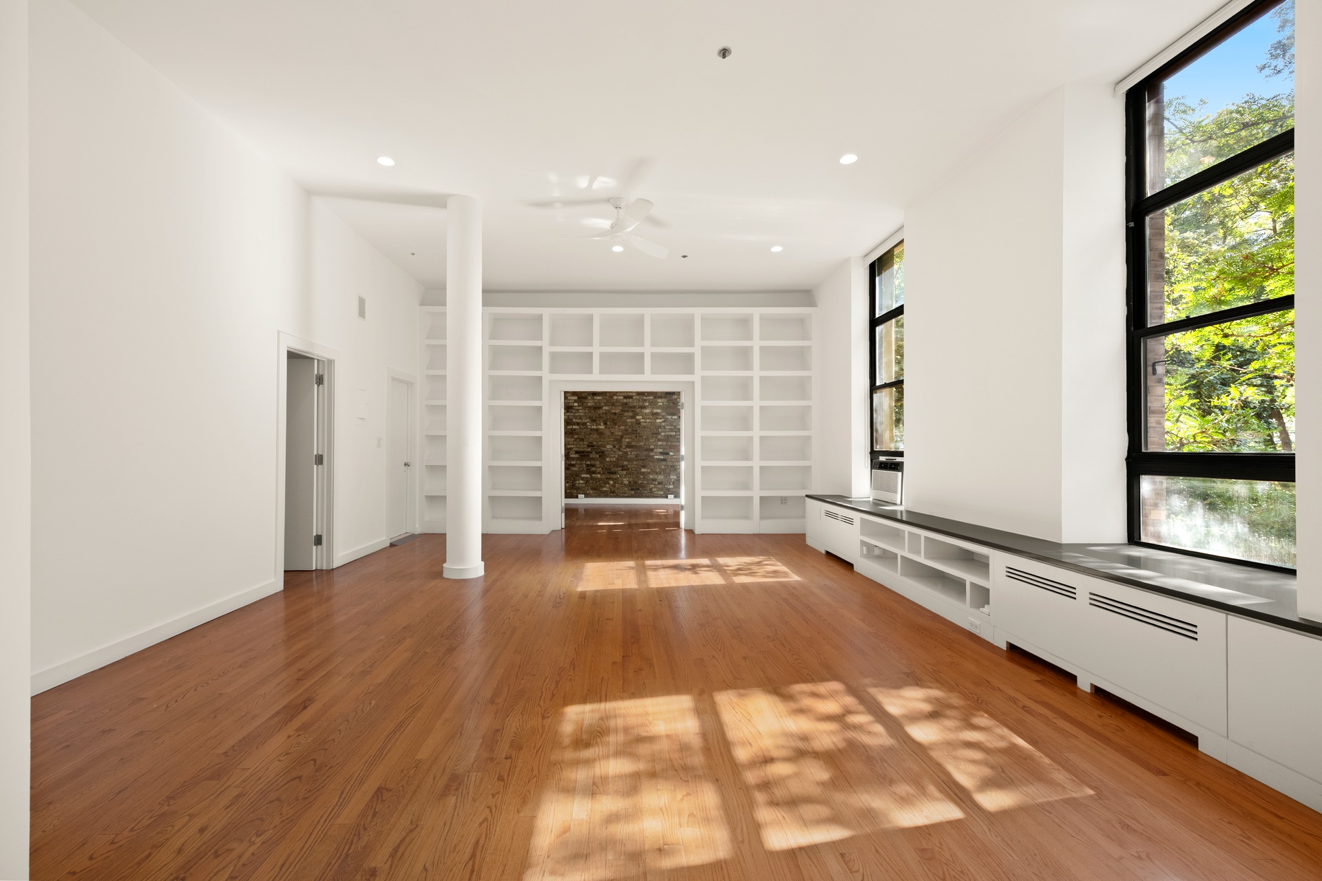 520 LaGuardia Place, Unit 2N Manhattan, NY 10012 - Photo 4 of 20 a view of an empty room with a fireplace and a window