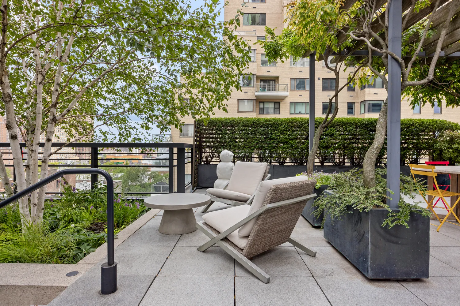 a view of a patio with couches table and chairs and potted plants