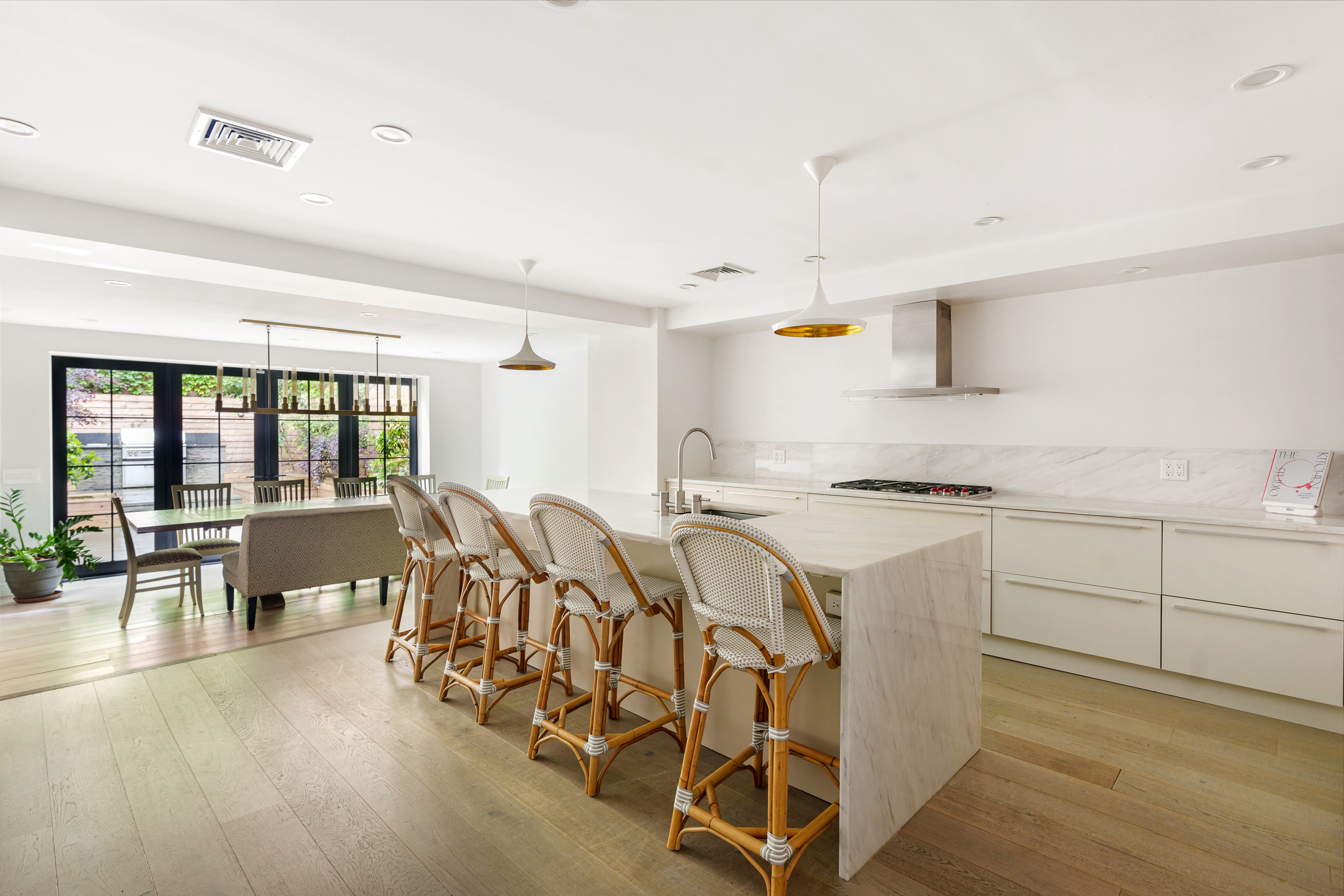265 6th Avenue Brooklyn, NY 11215 - Photo 7 of 24 a kitchen with appliances a sink a counter top space and living room view