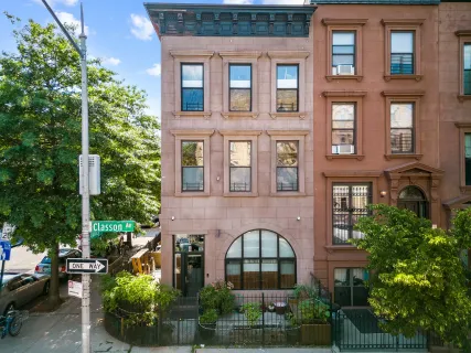 a front view of a building with garden