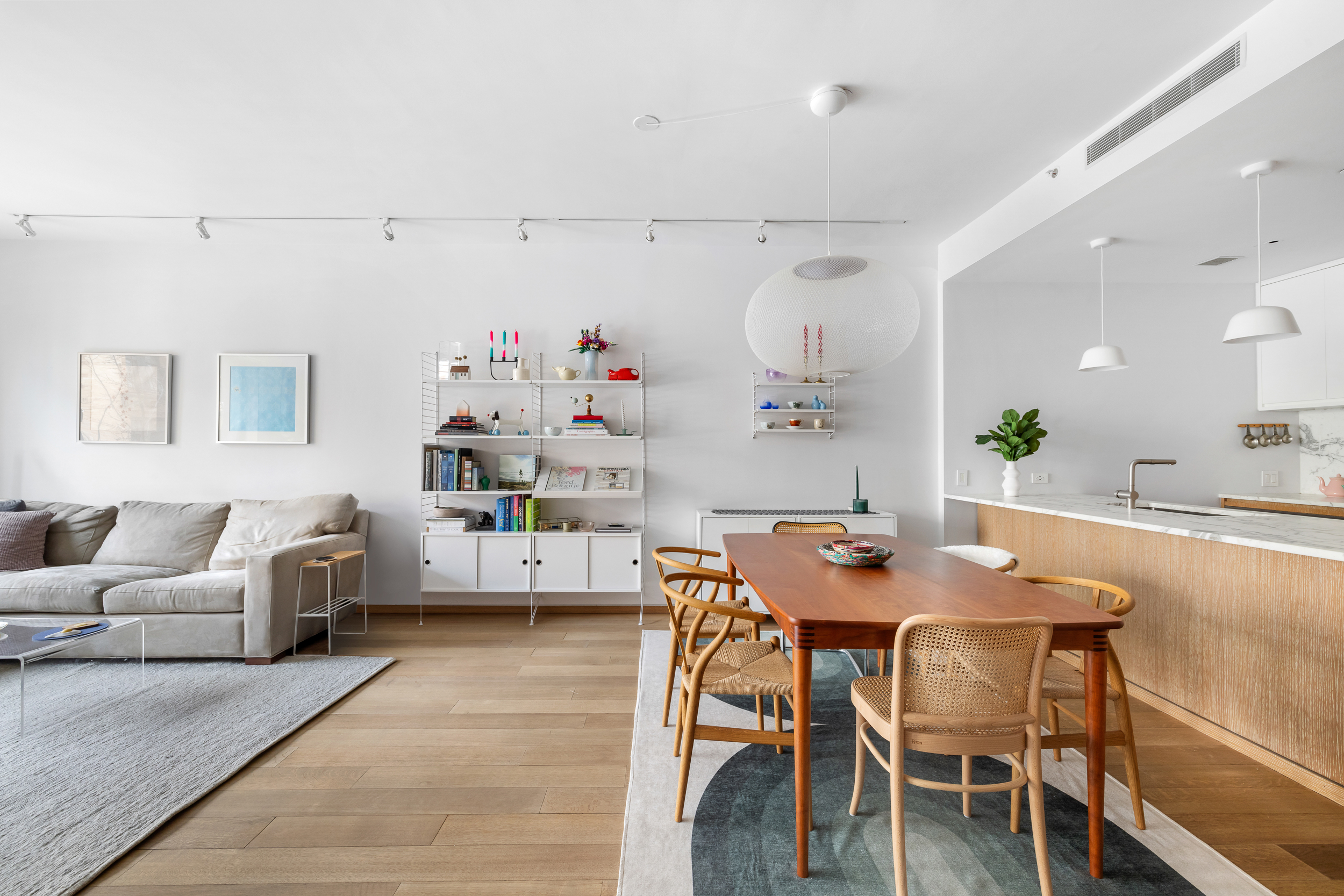 210 Pacific Street, Unit 3E Brooklyn, NY 11201 - Photo 3 of 14 a dining room with furniture and a kitchen view