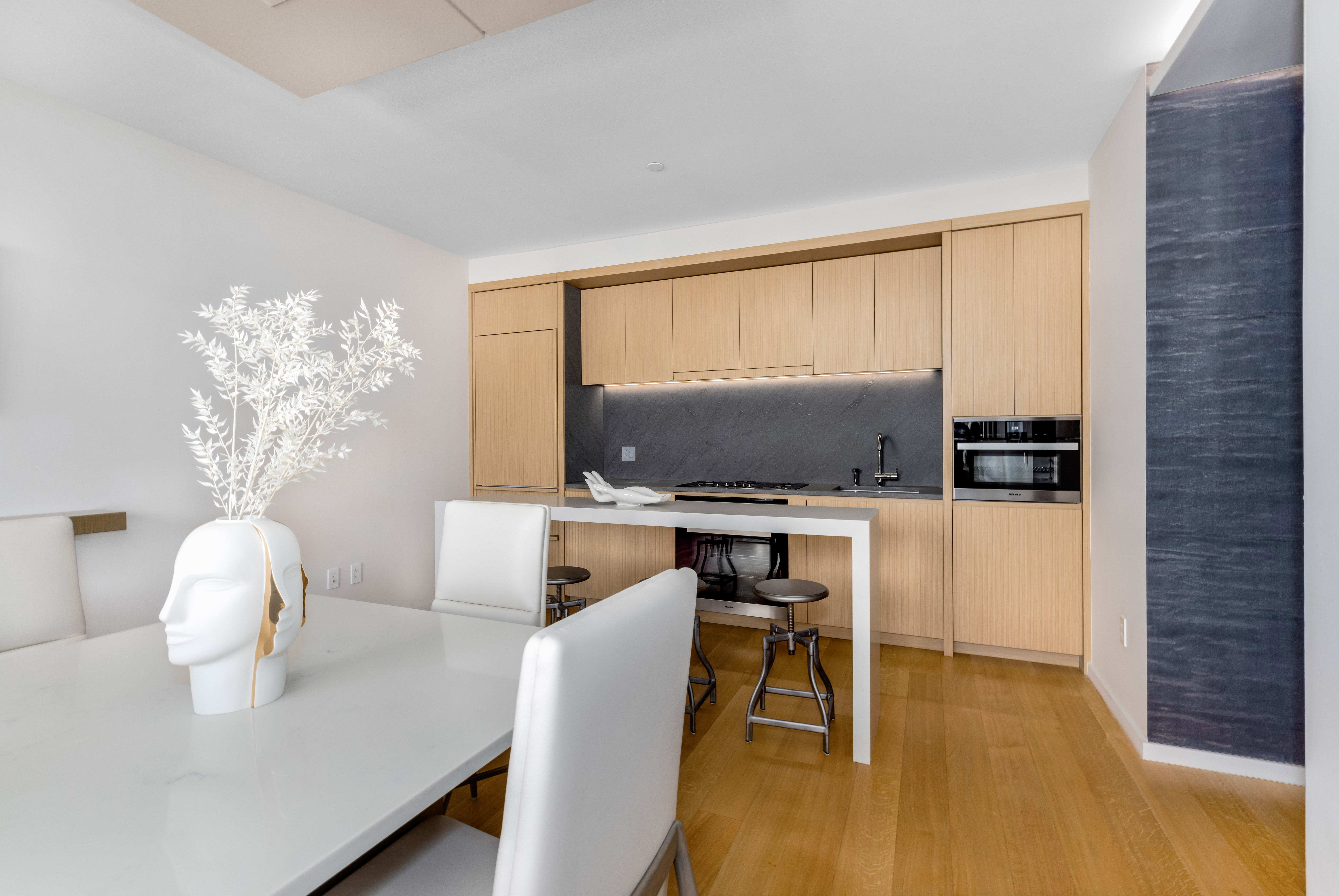565 Broome Street, Unit N11D Manhattan, NY 10013 - Photo 4 of 18 a living room with furniture and a flat screen tv