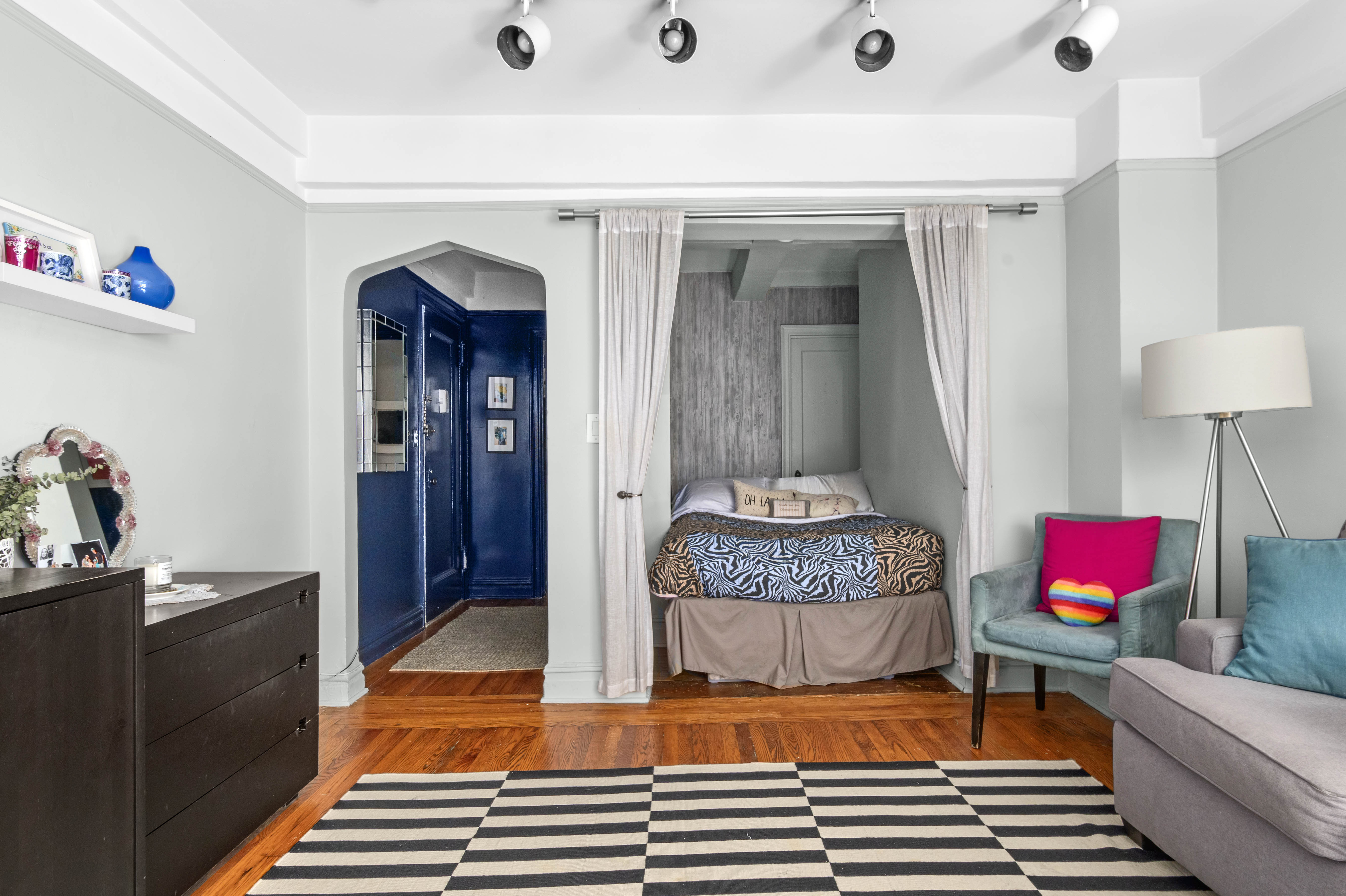 200 East 16th Street, Unit 2M Manhattan, NY 10003 - Photo 3 of 11 a living room with furniture and a wooden floor