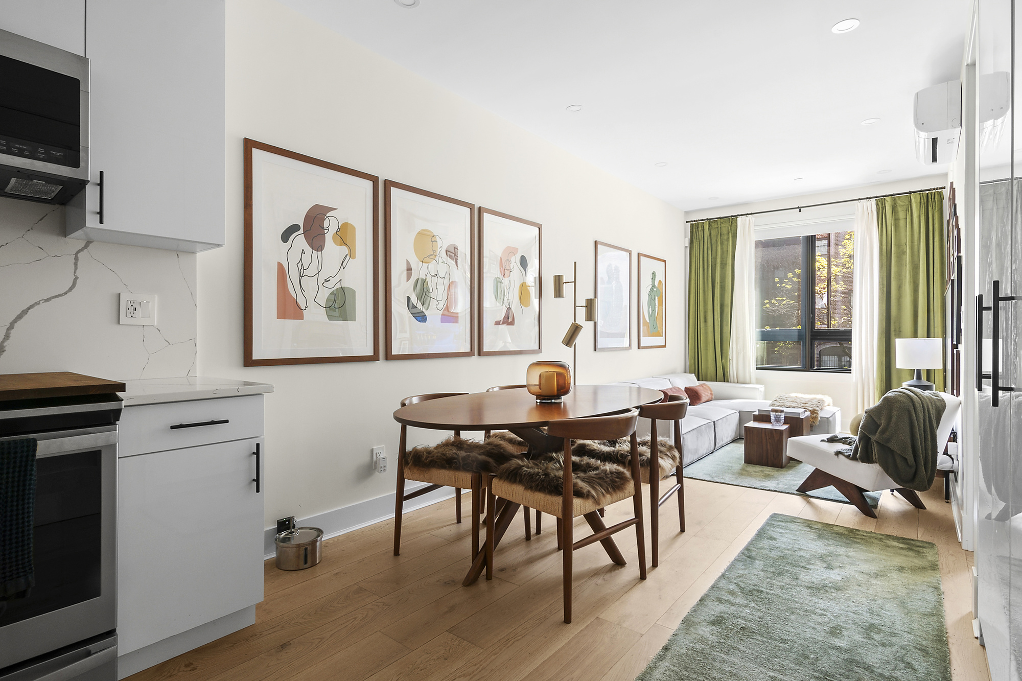 1489 Sterling Place, Unit 2A Brooklyn, NY 11213 - Photo 2 of 9 a living room with furniture and large windows