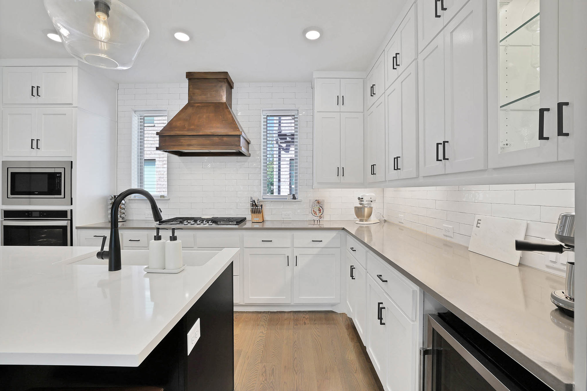 3920 Riesling Ridge Dallas, TX 75204 - Photo 5 of 26 a kitchen with stainless steel appliances a sink a stove and white cabinets