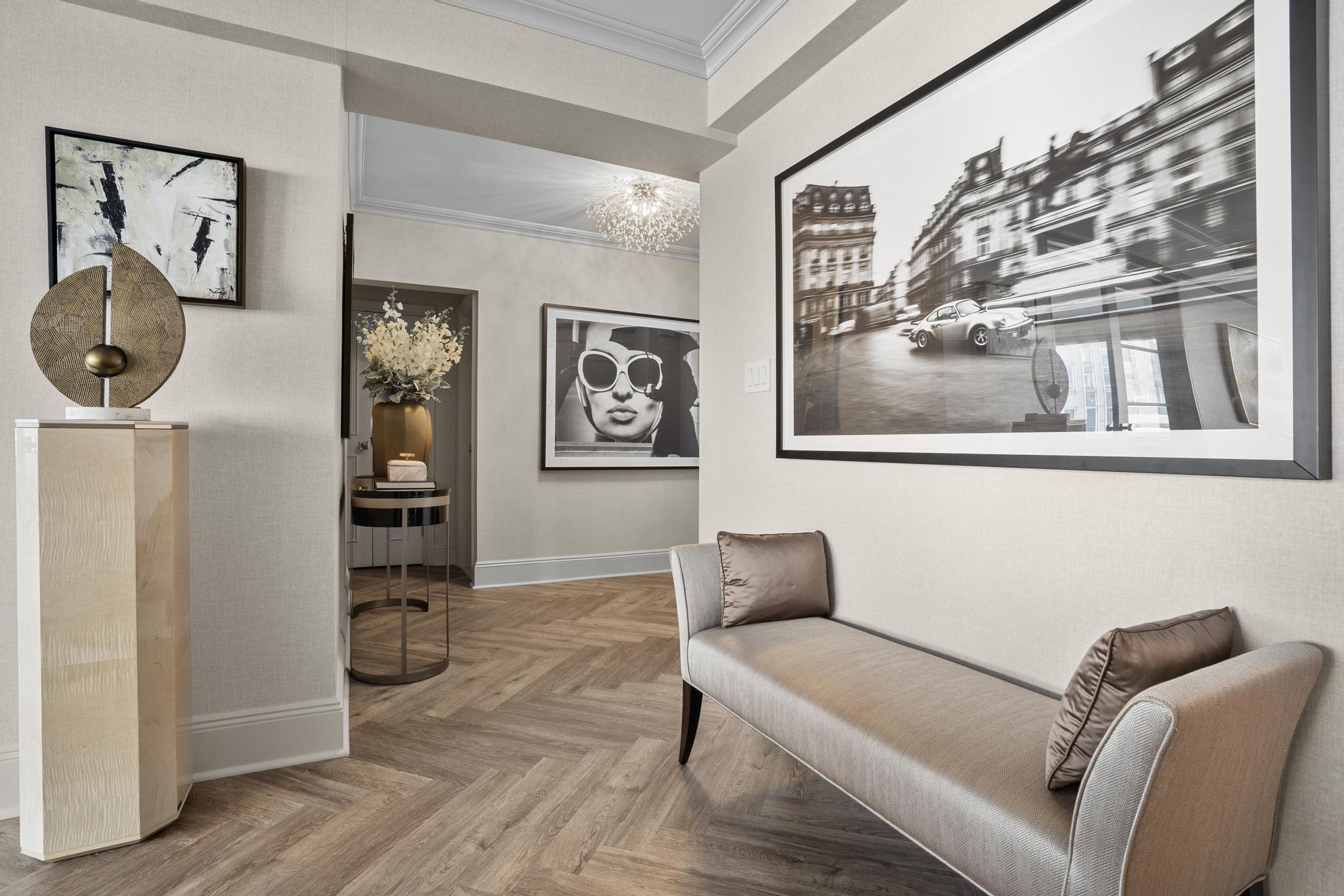 110 East 57th Street, Unit 10CD Manhattan, NY 10022 - Photo 3 of 16 a living room with furniture and a window