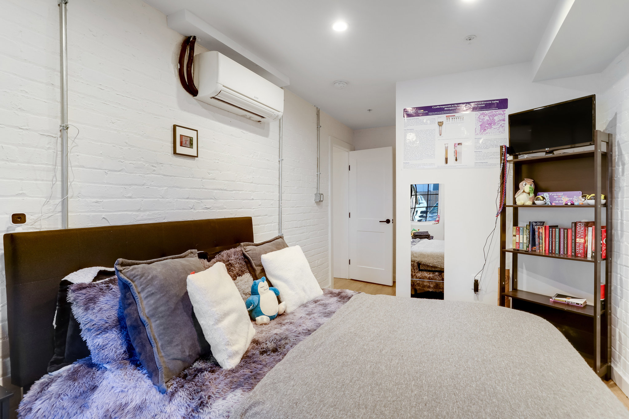 1920 35th Street Northwest Washington, DC 20007 - Photo 43 of 54 a bedroom with a bed and a television