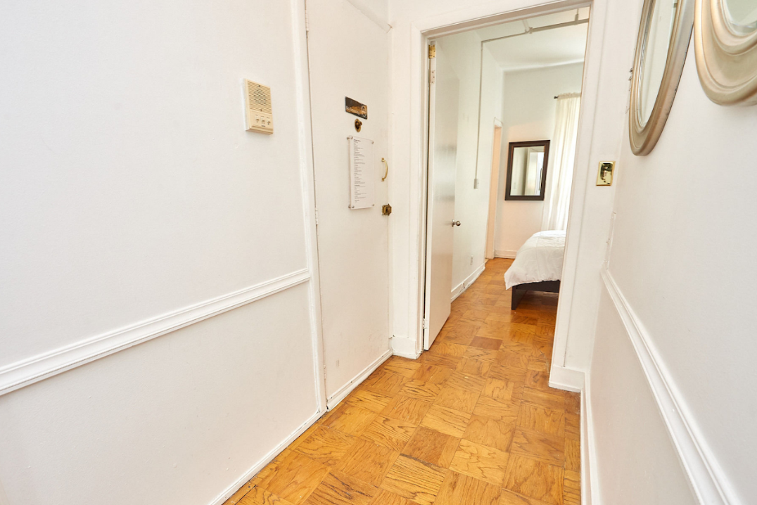 120 East 10th Street, Unit 3 Manhattan, NY 10003 - Photo 5 of 14 a view of a bathroom from a hallway