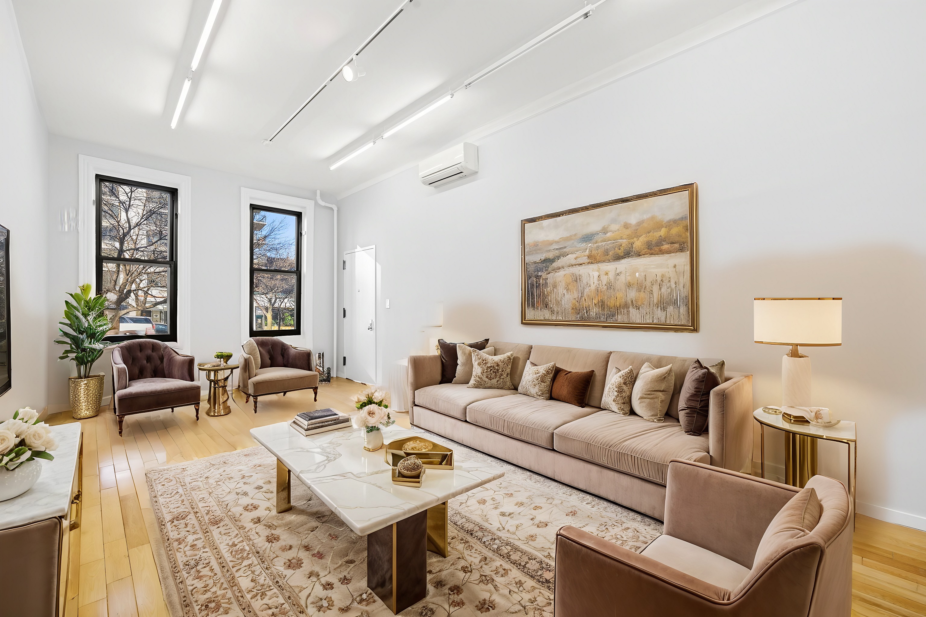 249 East Houston Street, Unit PARLOR Manhattan, NY 10002 - Photo 1 of 12 a living room with furniture and wooden floor