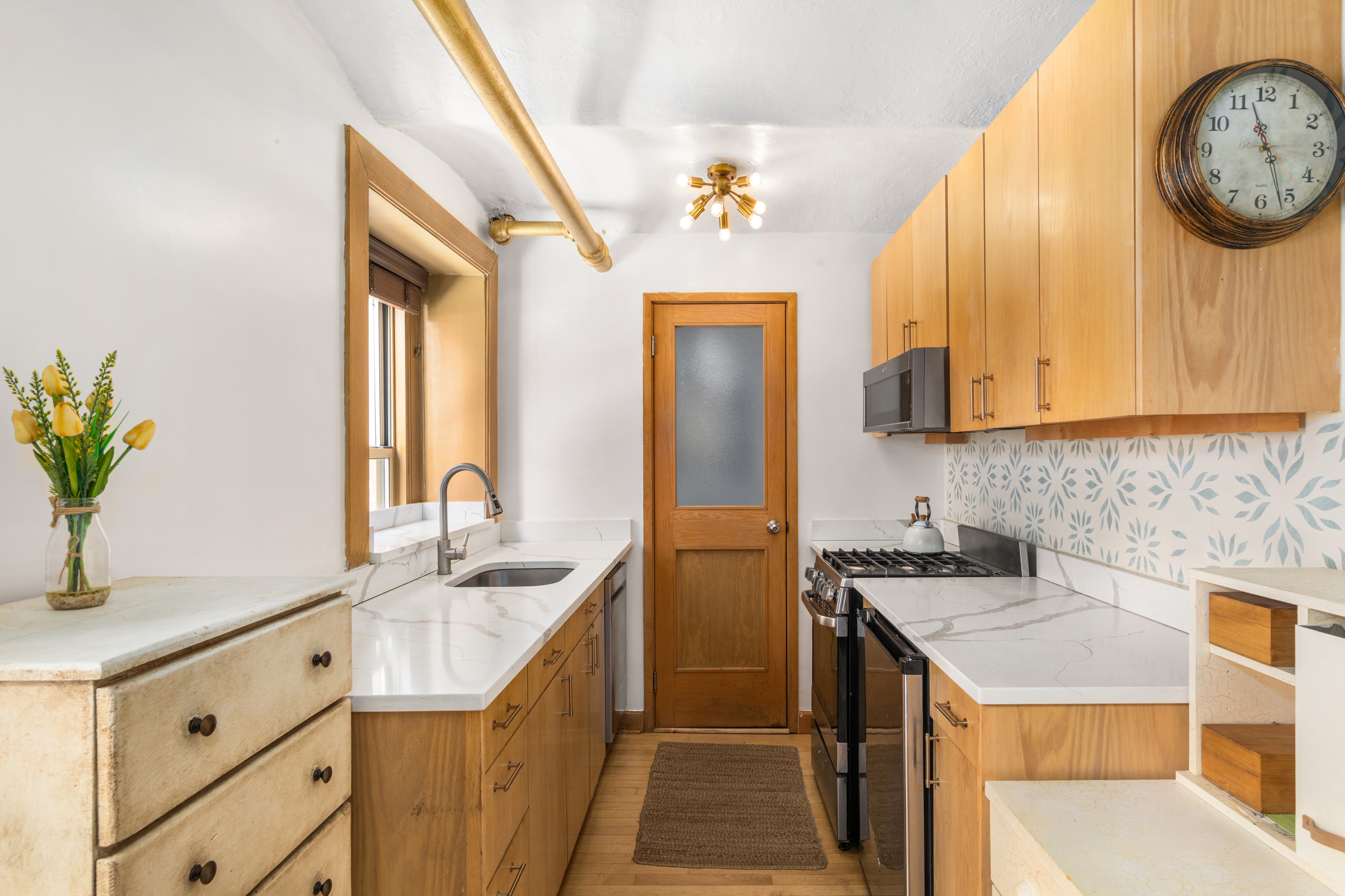 71 Barrow Street, Unit 19 Manhattan, NY 10014 - Photo 5 of 9 a bathroom with a sink and a mirror
